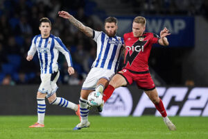 SAN SEBASTIAN, SPAIN - OCTOBER 05: Duje Caleta-Car of Real Sociedad is challenged by Alexandre Alemao of Rayo Vallecano during the LaLiga EA Sports match between Real Sociedad and Rayo Vallecano de Madrid at Reale Arena on October 05, 2025 in San Sebastian, Spain. (Photo by Juan Manuel Serrano Arce/Getty Images)